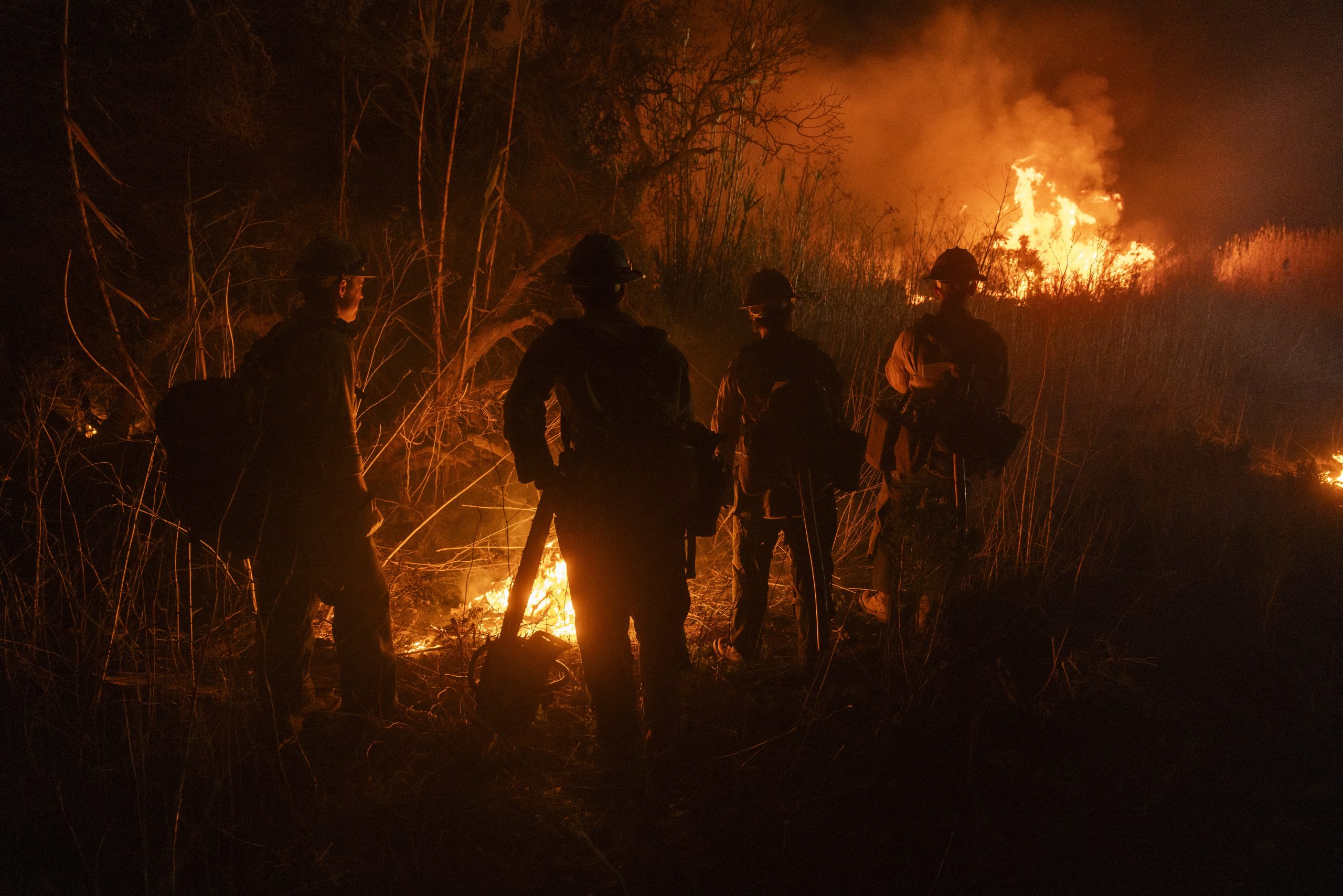 A new fire breaks out in Southern California as high winds threaten progress