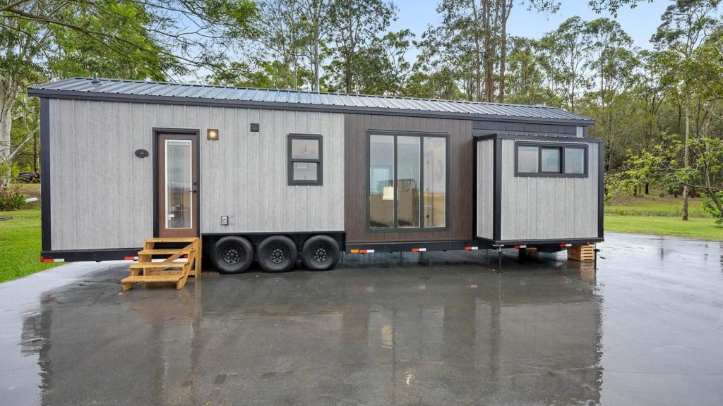 Sizable tiny house expands living space with triple slide-outs